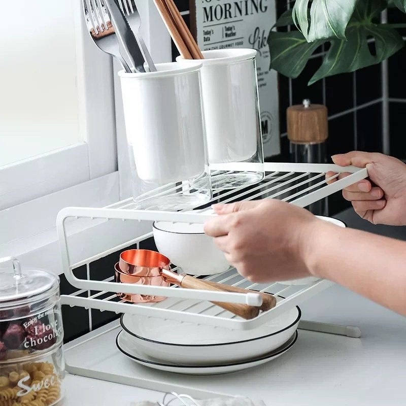 Stackable multi – layer wrought – iron storage rack, which is used for storing and organizing seasoning containers, bowls, plates, spoons, chopsticks, etc. in the kitchen