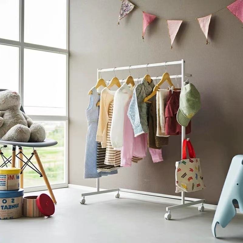 Simple double-rod clothes hanger, movable with pulleys, can be used to store clothes and placed on the balcony or in the bedroom