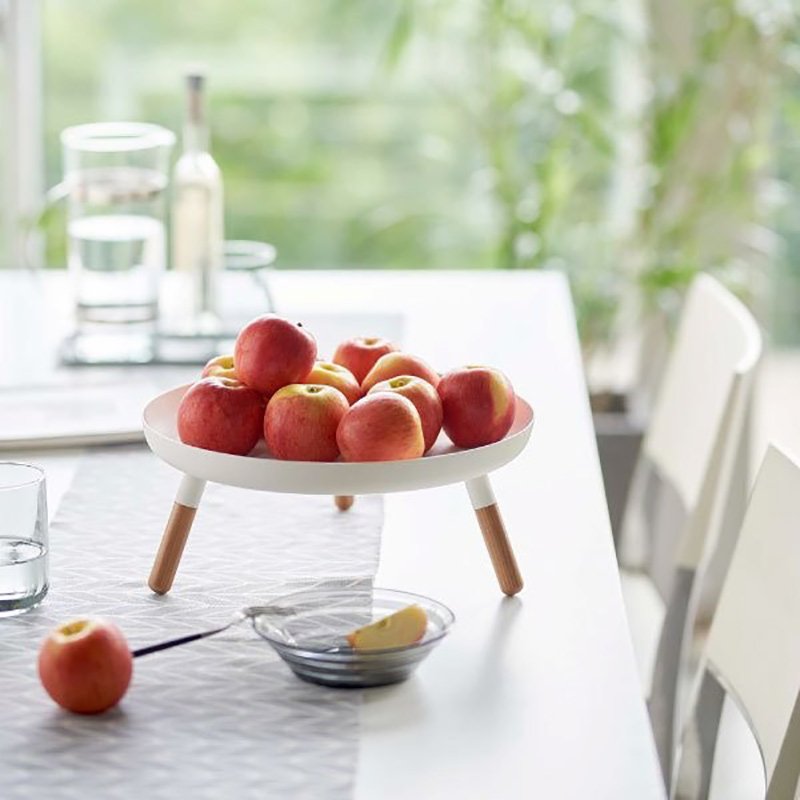 Multifunctional wrought-iron storage tray which can be used as a fruit plate to hold fruits, snacks, desserts and drinks